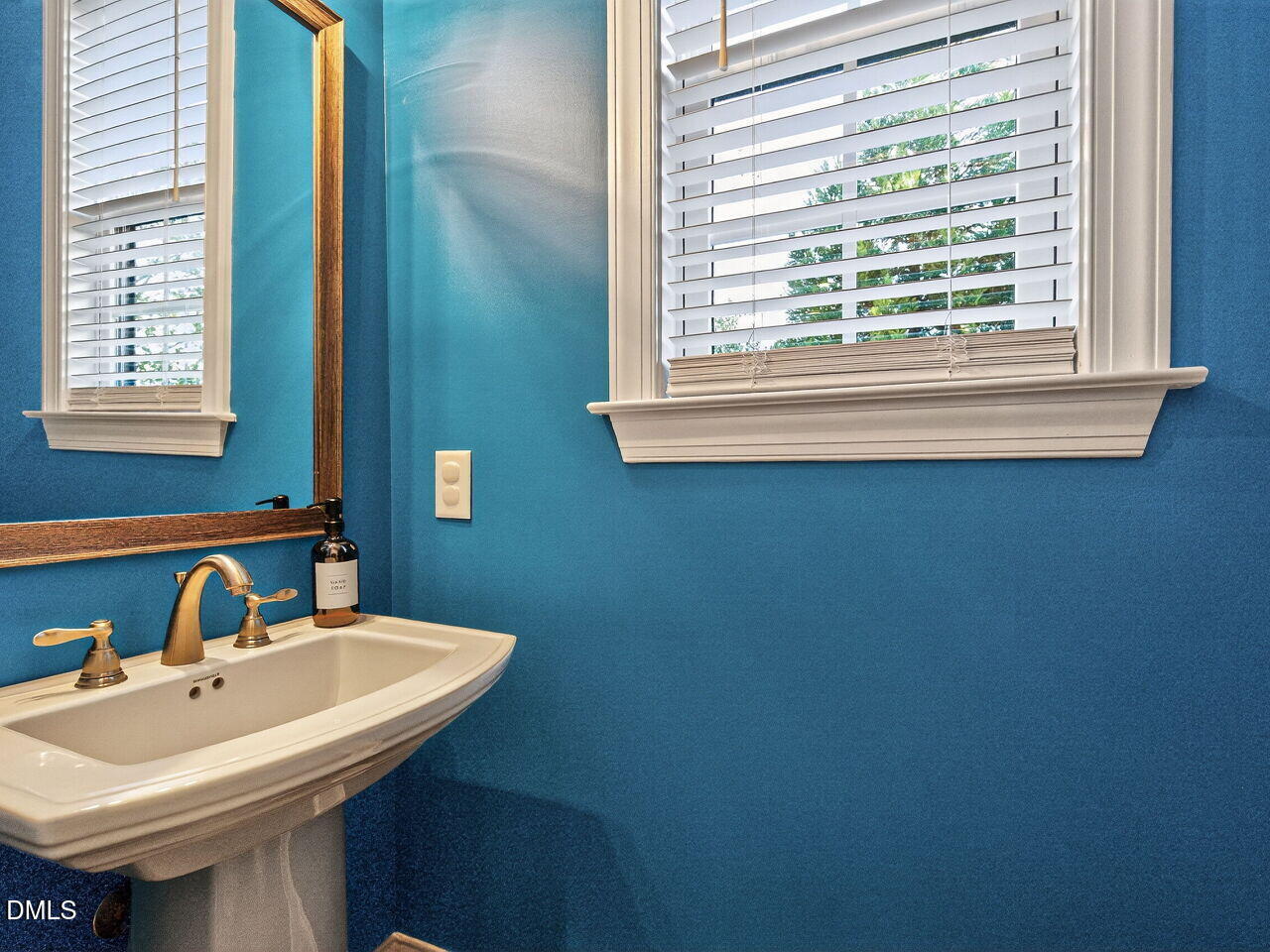 1609 Bowery Drive Raleigh, NC 27607 - Photo 20 of 30 a bathroom with a sink and a mirror