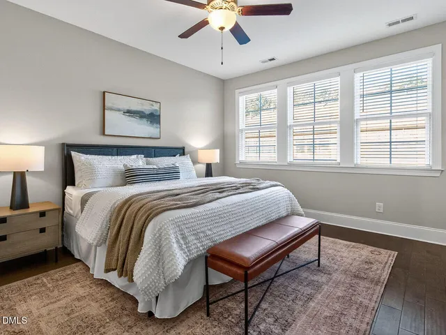 a bedroom with bed and a window