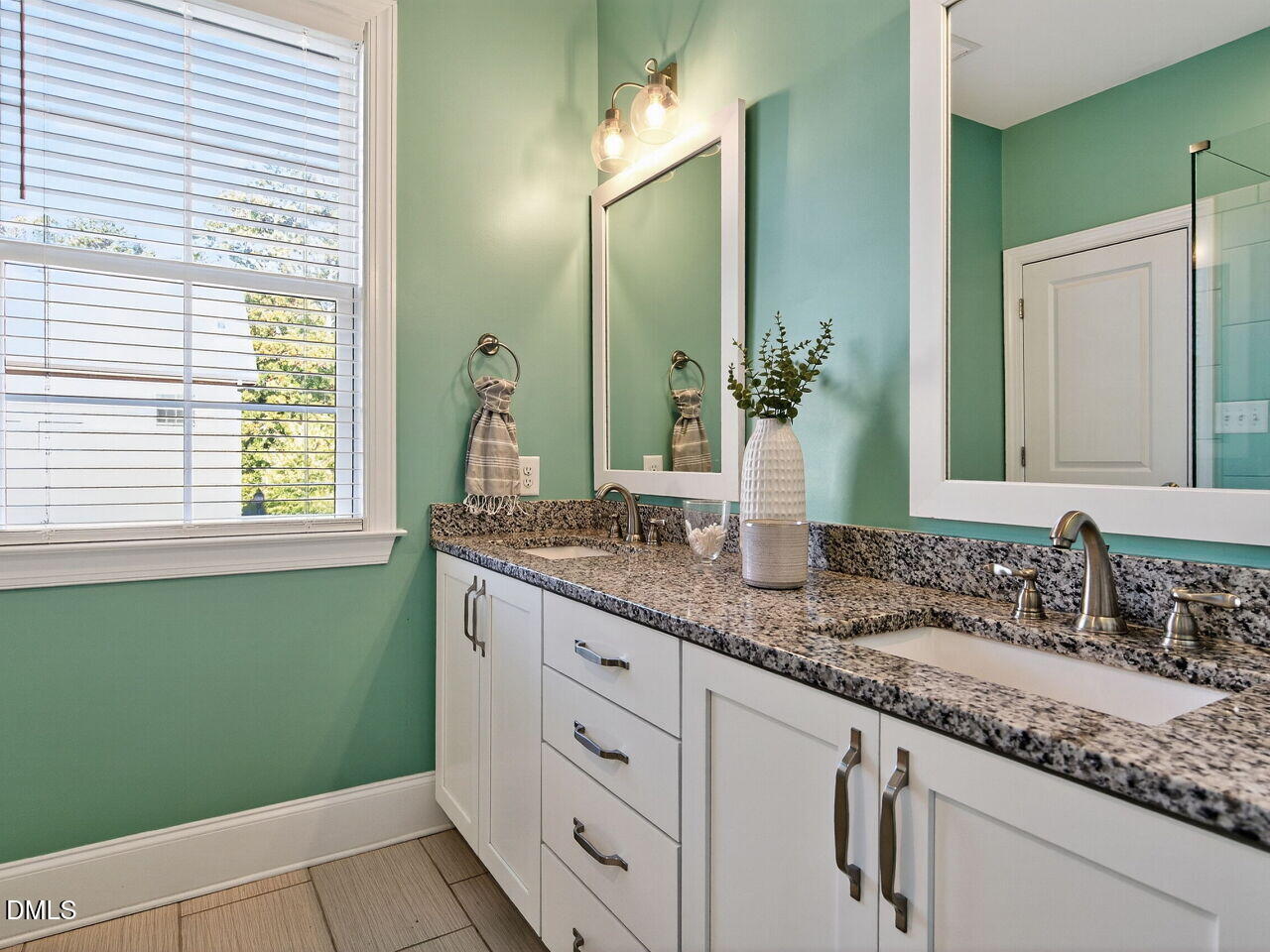 1609 Bowery Drive Raleigh, NC 27607 - Photo 24 of 30 a bathroom with a granite countertop sink and a mirror