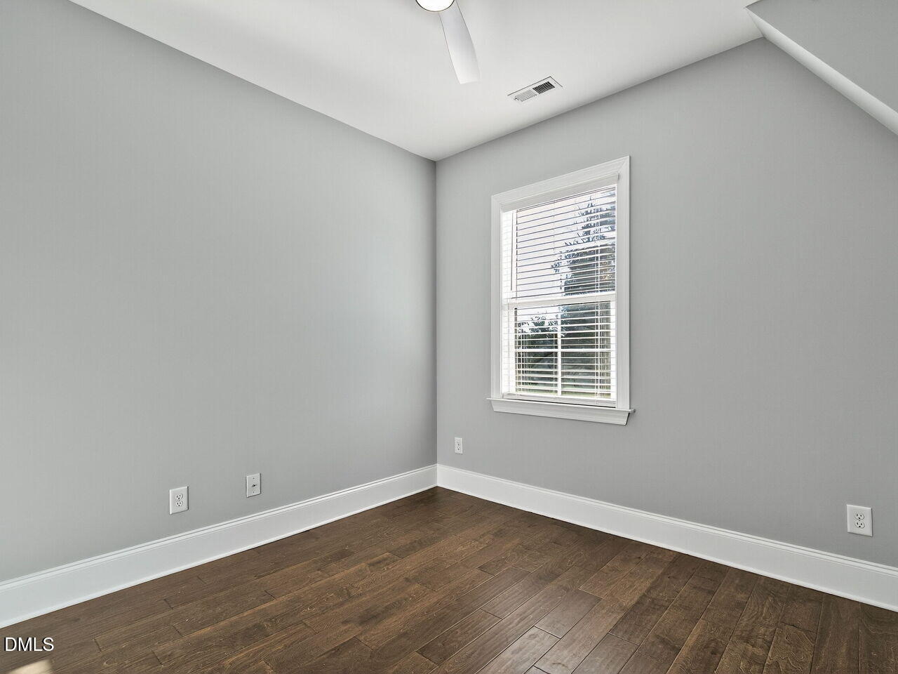 1609 Bowery Drive Raleigh, NC 27607 - Photo 26 of 30 a view of an empty room with wooden floor and a window