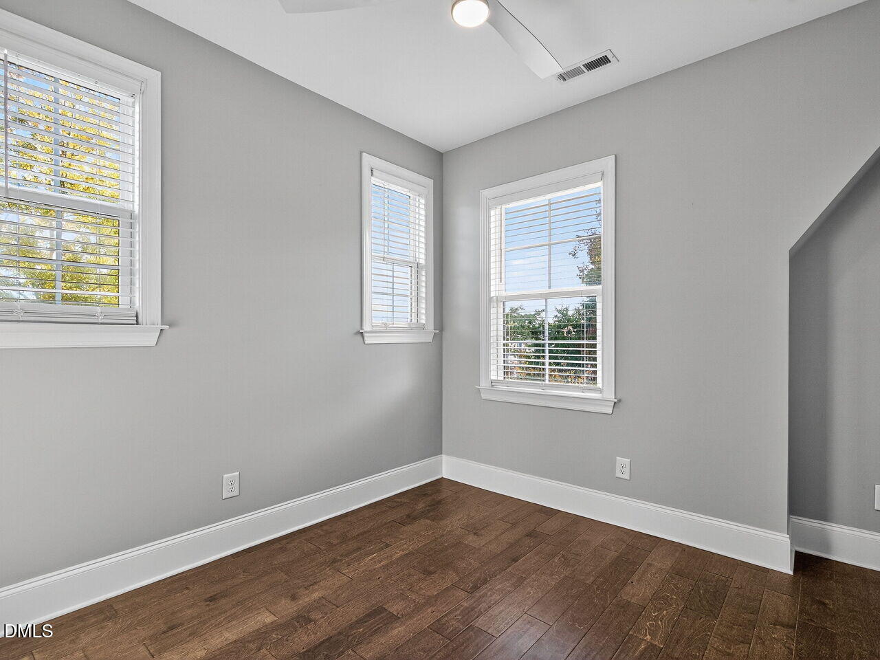 1609 Bowery Drive Raleigh, NC 27607 - Photo 28 of 30 a view of an empty room with wooden floor and a window