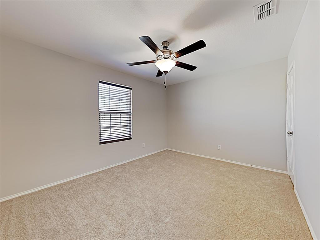 1620 Gayla Creek Drive Little Elm, TX 75068 - Photo 11 of 13 an empty room with a window and a ceiling fan
