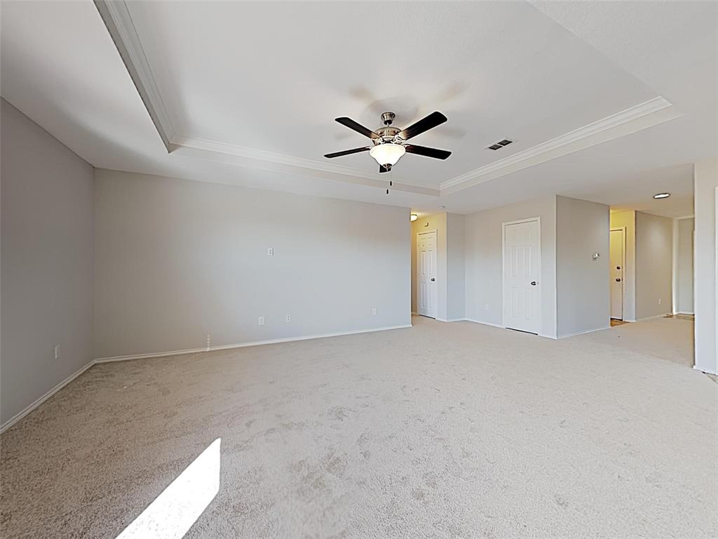 1620 Gayla Creek Drive Little Elm, TX 75068 - Photo 4 of 13 an empty room with a ceiling fan and window
