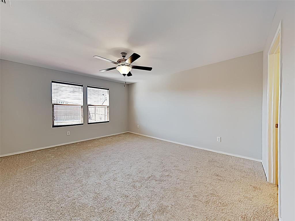 1620 Gayla Creek Drive Little Elm, TX 75068 - Photo 8 of 13 an empty room with windows and ceiling fan view