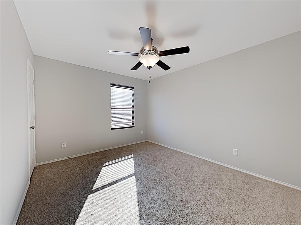 1620 Gayla Creek Drive Little Elm, TX 75068 - Photo 10 of 13 an empty room with windows and fan