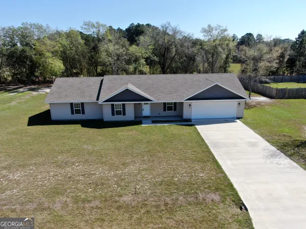 a house with trees in the background