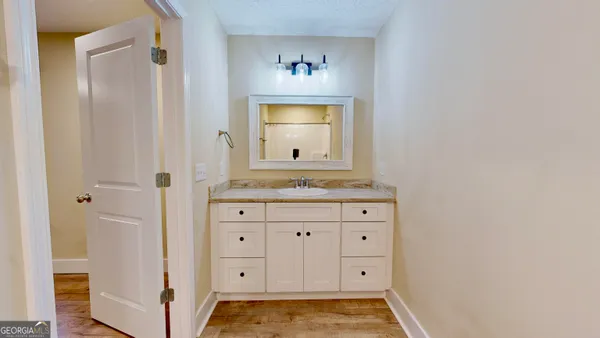 a bathroom with a sink and a mirror
