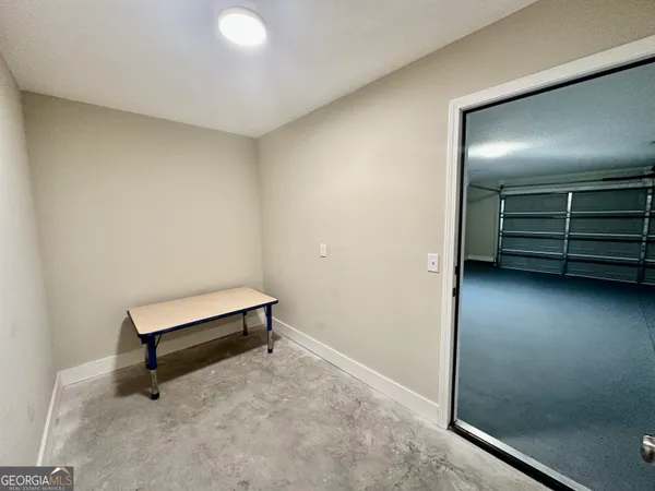 an empty room with a bench