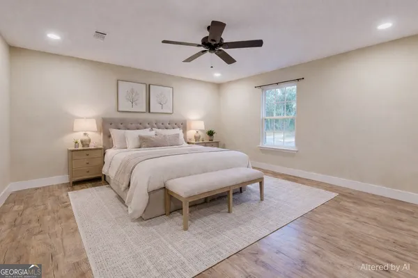 a bedroom with a bed and window