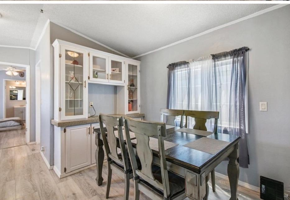 92 Lyle Way Davis, CA 95618 - Photo 1 of 1 a view of a dining room with furniture and window