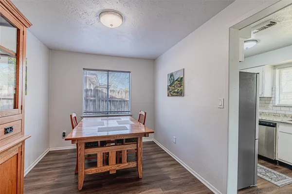 a view of wooden floor and a workspace