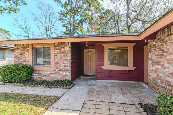 a view of front door of a house with a yard