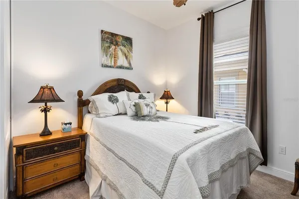 a bedroom with bed and a window
