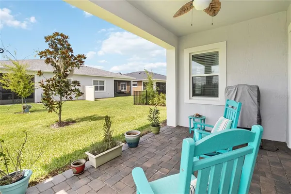 a view of an house with swimming pool and furniture