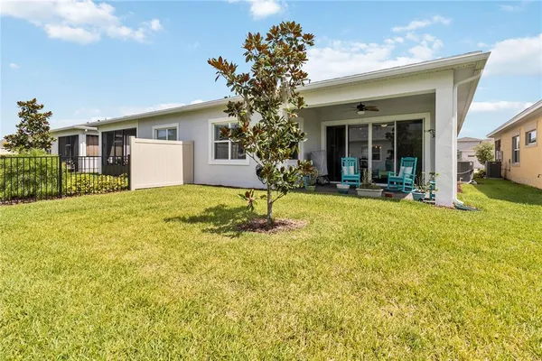 a house view with a sitting space and garden