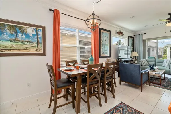 a view of a dining room with furniture window and outside view