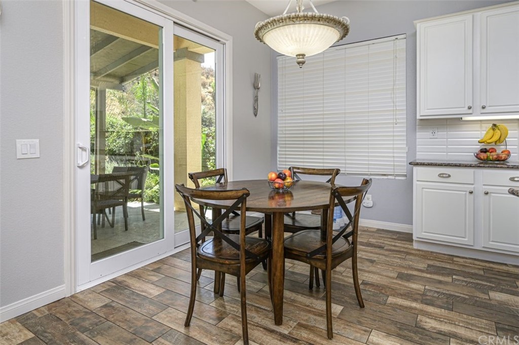 33915 Pinehurst Drive Yucaipa, CA 92399 - Photo 11 of 33 a view of a dining room with furniture and wooden floor