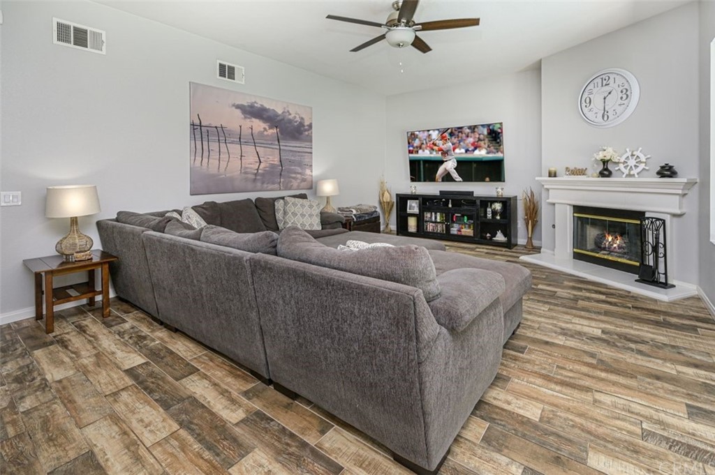 33915 Pinehurst Drive Yucaipa, CA 92399 - Photo 13 of 33 a living room with furniture and a fireplace