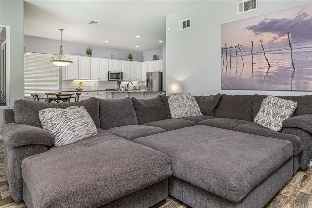 33915 Pinehurst Drive Yucaipa, CA 92399 - Photo 14 of 33 a living room with furniture and a large window