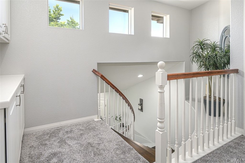 33915 Pinehurst Drive Yucaipa, CA 92399 - Photo 17 of 33 a view of staircase with white walls and a window
