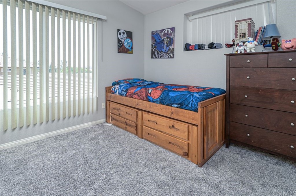 33915 Pinehurst Drive Yucaipa, CA 92399 - Photo 22 of 33 a bed room with a bed and a window