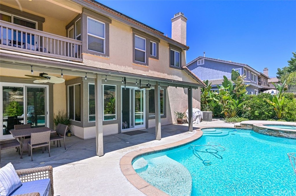 33915 Pinehurst Drive Yucaipa, CA 92399 - Photo 25 of 33 a view of a house with a swimming pool and sitting area