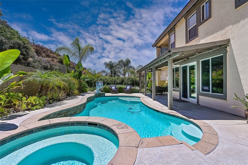 33915 Pinehurst Drive Yucaipa, CA 92399 - Photo 26 of 33 a swimming pool with outdoor seating and yard