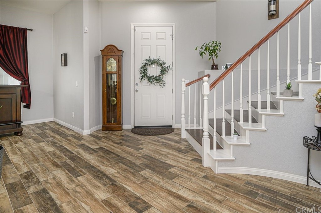 33915 Pinehurst Drive Yucaipa, CA 92399 - Photo 3 of 33 a view of entryway with wooden floor and stairs