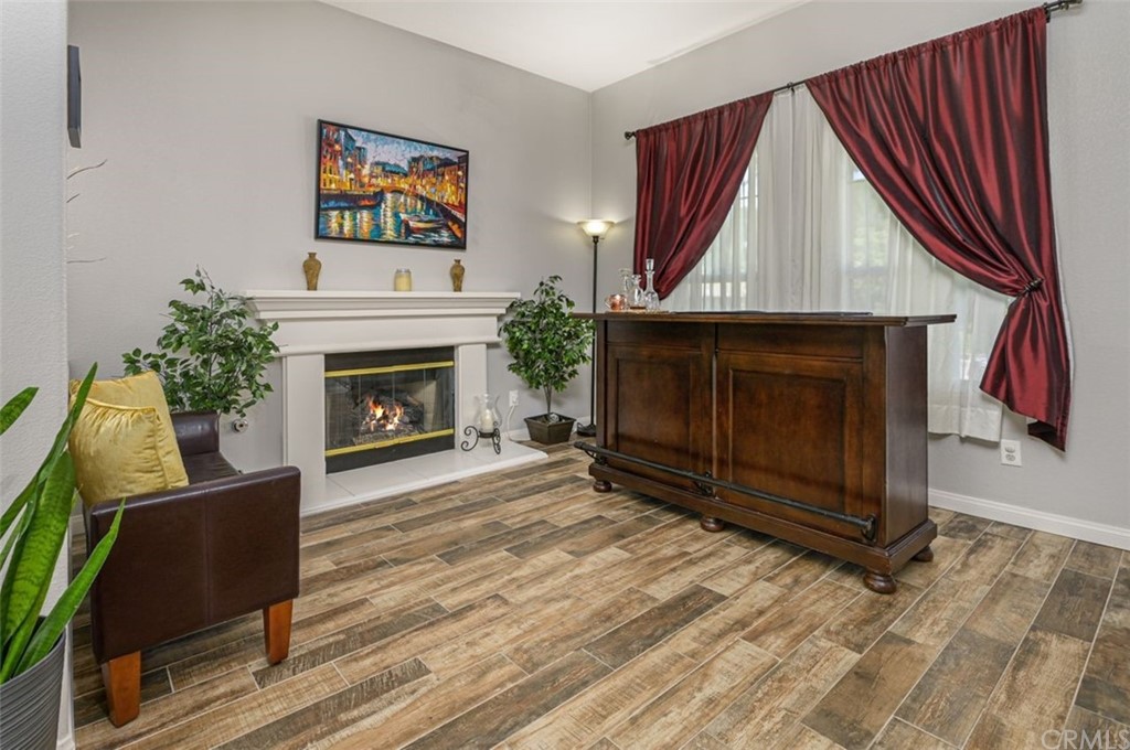 33915 Pinehurst Drive Yucaipa, CA 92399 - Photo 5 of 33 a living room with a fireplace windows and a fireplace