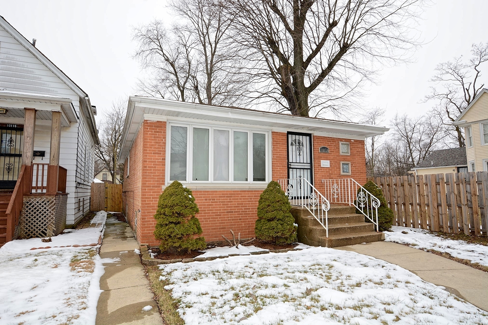 10114 South Malta Street Chicago, IL 60643 - Photo 1 of 13 a view of a house with snow on the roof
