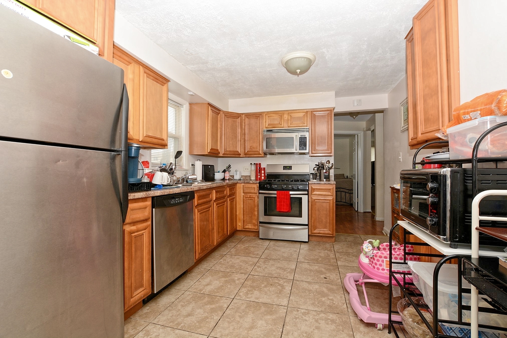 10114 South Malta Street Chicago, IL 60643 - Photo 5 of 13 a kitchen with stainless steel appliances granite countertop a refrigerator sink and stove