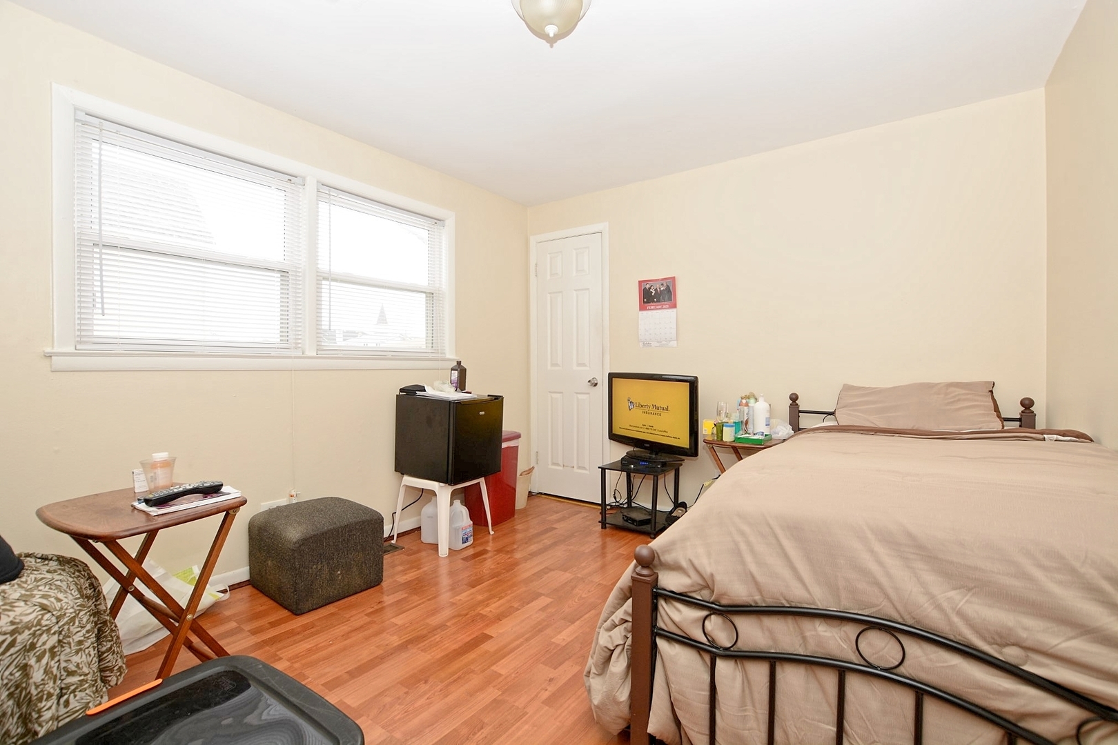 10114 South Malta Street Chicago, IL 60643 - Photo 6 of 13 a bedroom with a bed a chair and a dresser next to a window