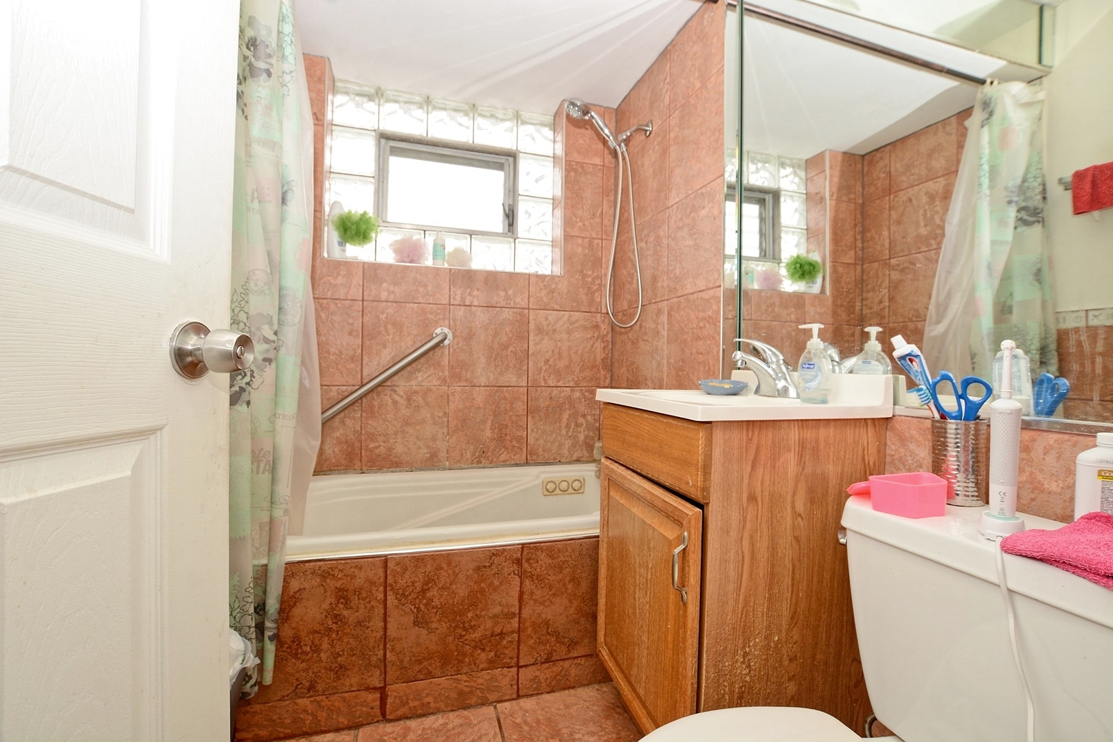 10114 South Malta Street Chicago, IL 60643 - Photo 7 of 13 a bathroom with a sink mirror vanity and toilet