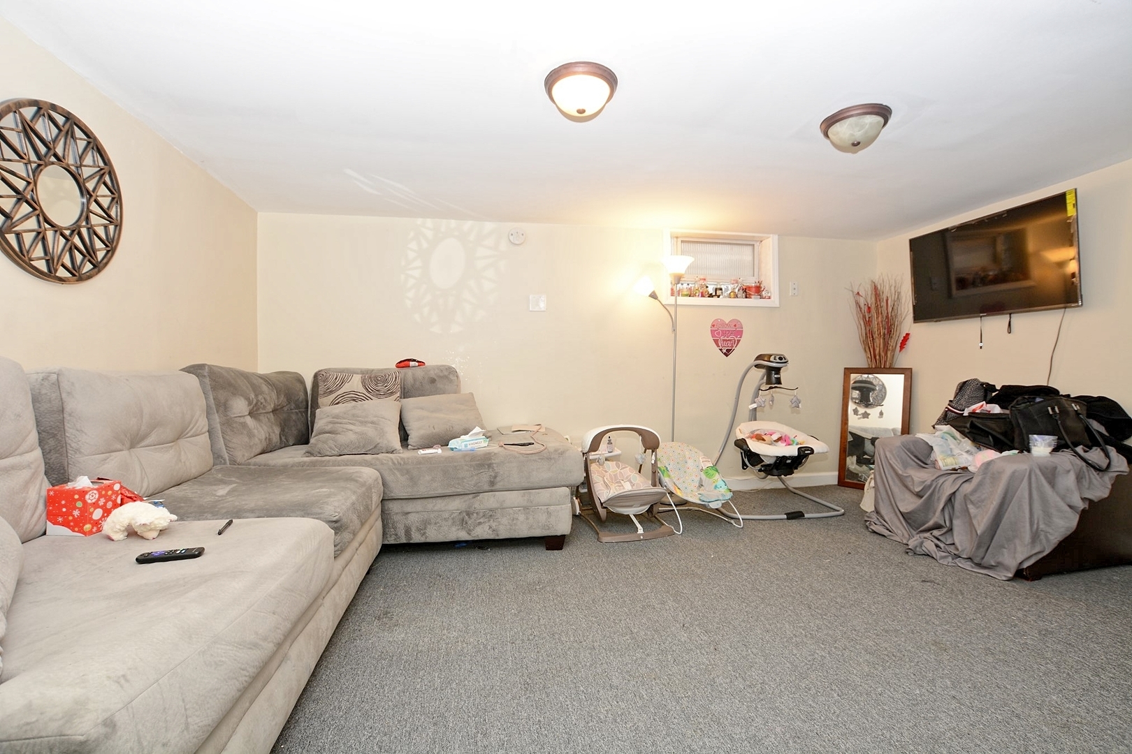 10114 South Malta Street Chicago, IL 60643 - Photo 9 of 13 a living room with furniture and a flat screen tv