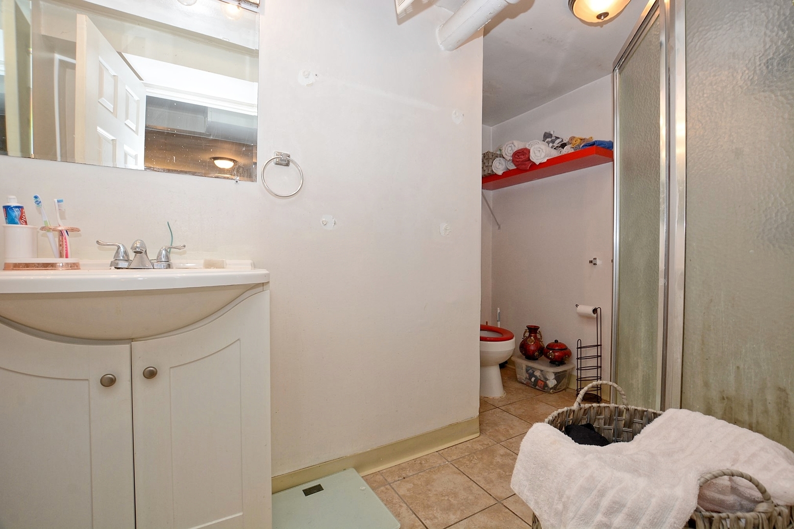 10114 South Malta Street Chicago, IL 60643 - Photo 10 of 13 a bathroom with a sink and a mirror