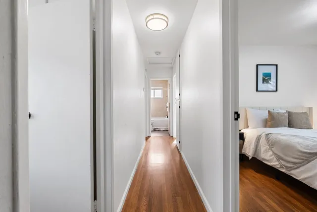 a view of a bedroom from a hallway