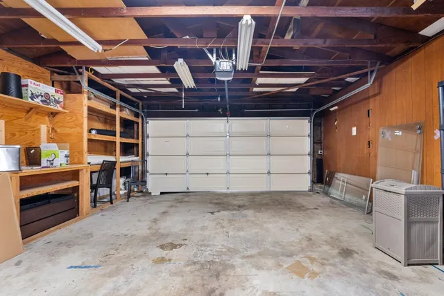 a view of a room with wooden shelves