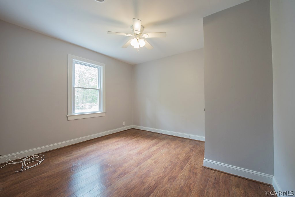 534 Old Bermuda Hundred Road Chester, VA 23836 - Photo 11 of 38 an empty room with wooden floor and windows