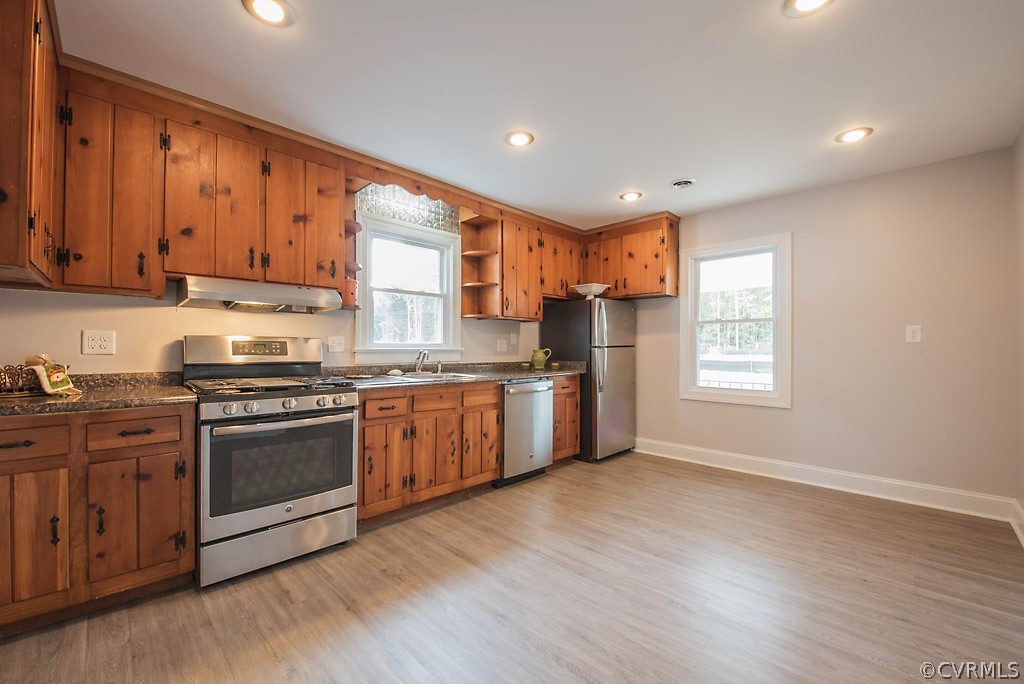 534 Old Bermuda Hundred Road Chester, VA 23836 - Photo 17 of 38 a kitchen with stainless steel appliances granite countertop a stove a sink and a refrigerator