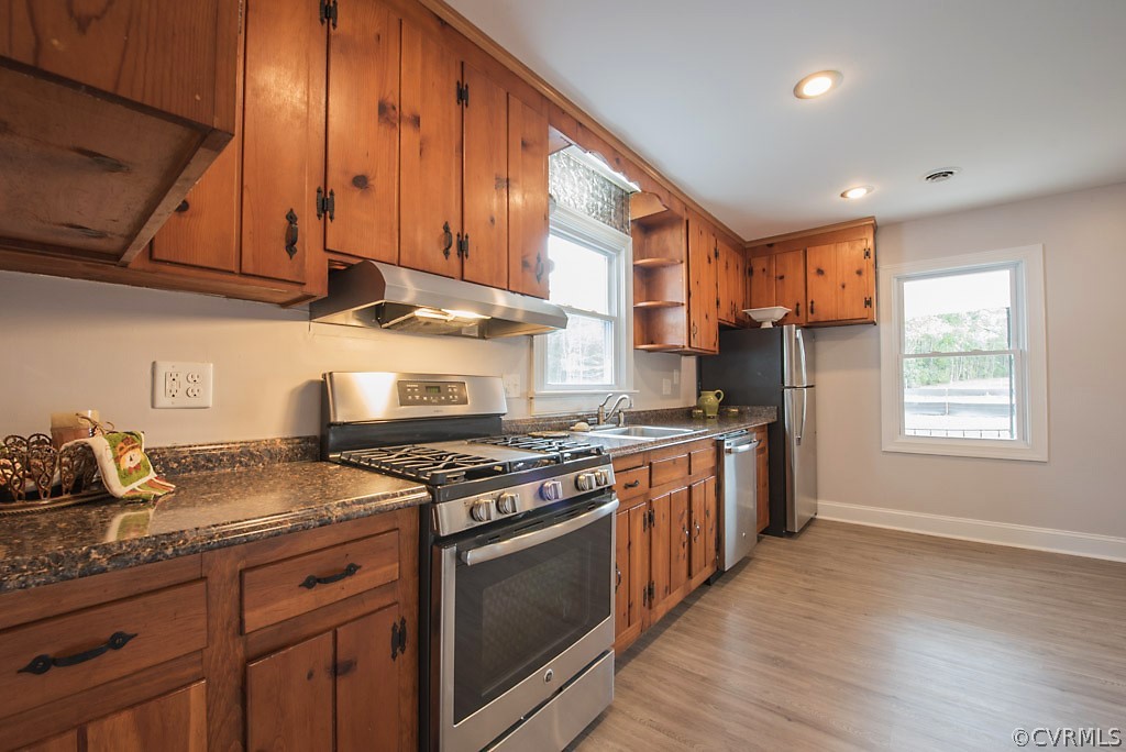534 Old Bermuda Hundred Road Chester, VA 23836 - Photo 20 of 38 a kitchen with stainless steel appliances granite countertop wooden cabinets stove top oven and sink