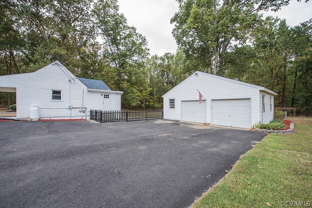 534 Old Bermuda Hundred Road Chester, VA 23836 - Photo 27 of 38 a view of a white house with a yard and large trees