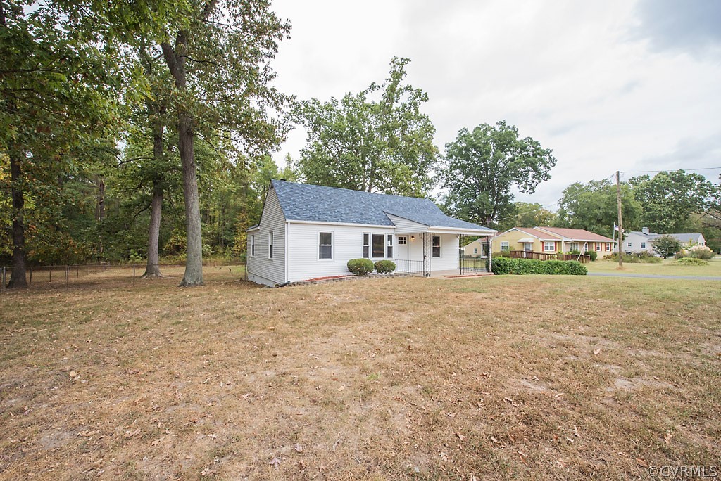 534 Old Bermuda Hundred Road Chester, VA 23836 - Photo 32 of 38 a front view of a house with a yard and trees