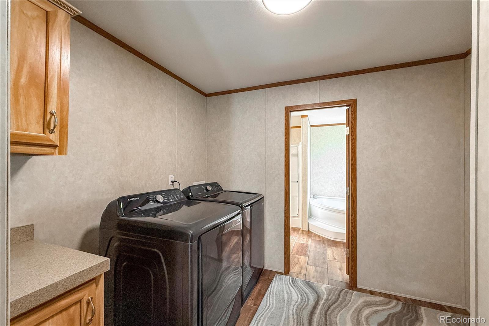 16412 Higgins Avenue Fort Lupton, CO 80621 - Photo 17 of 27 a utility room with dryer and washer