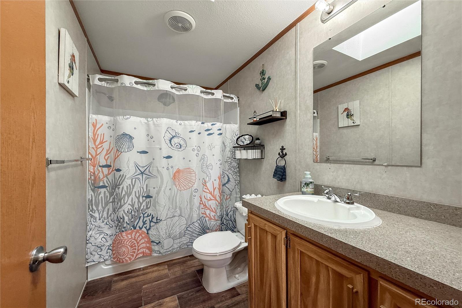 16412 Higgins Avenue Fort Lupton, CO 80621 - Photo 21 of 27 a bathroom with a sink toilet and shower