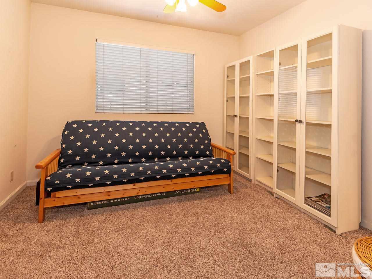 2135 Evergreen Reno, NV 89521 - Photo 17 of 20 a bed sitting in a bedroom next to a window