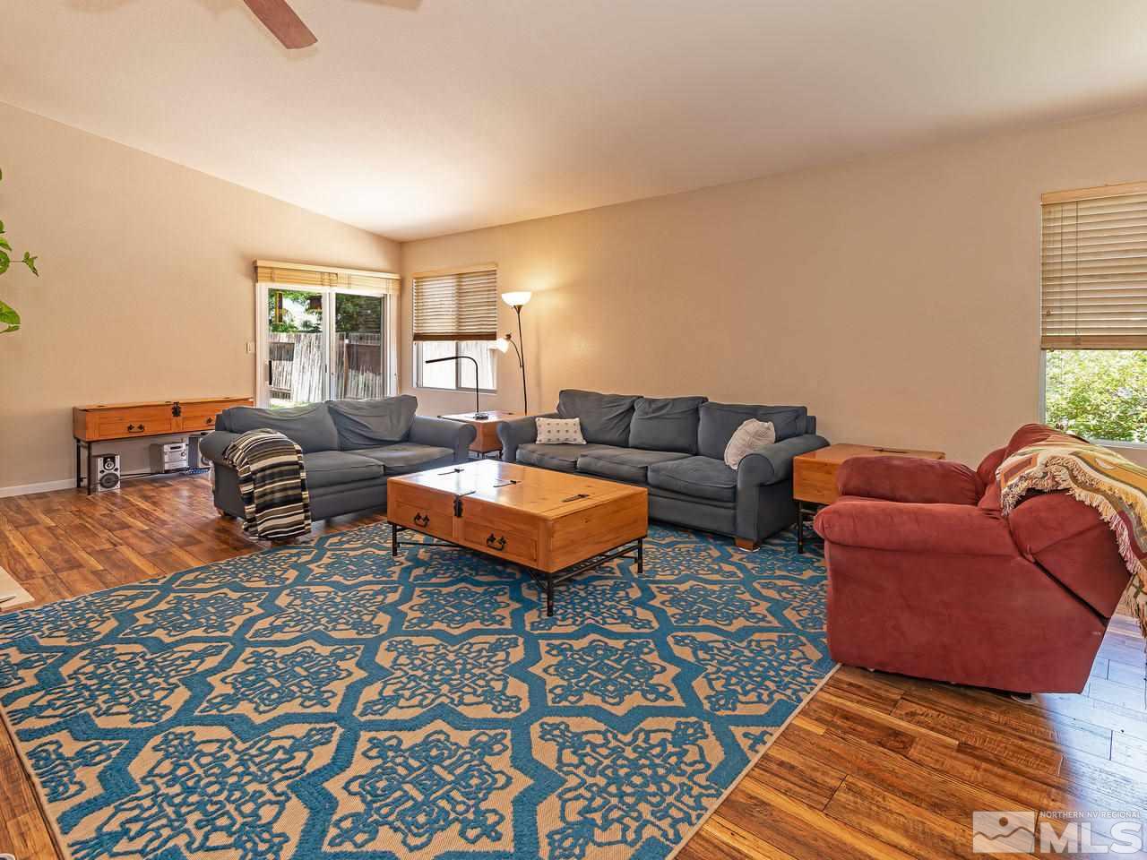 2135 Evergreen Reno, NV 89521 - Photo 5 of 20 a living room with furniture a rug and a window