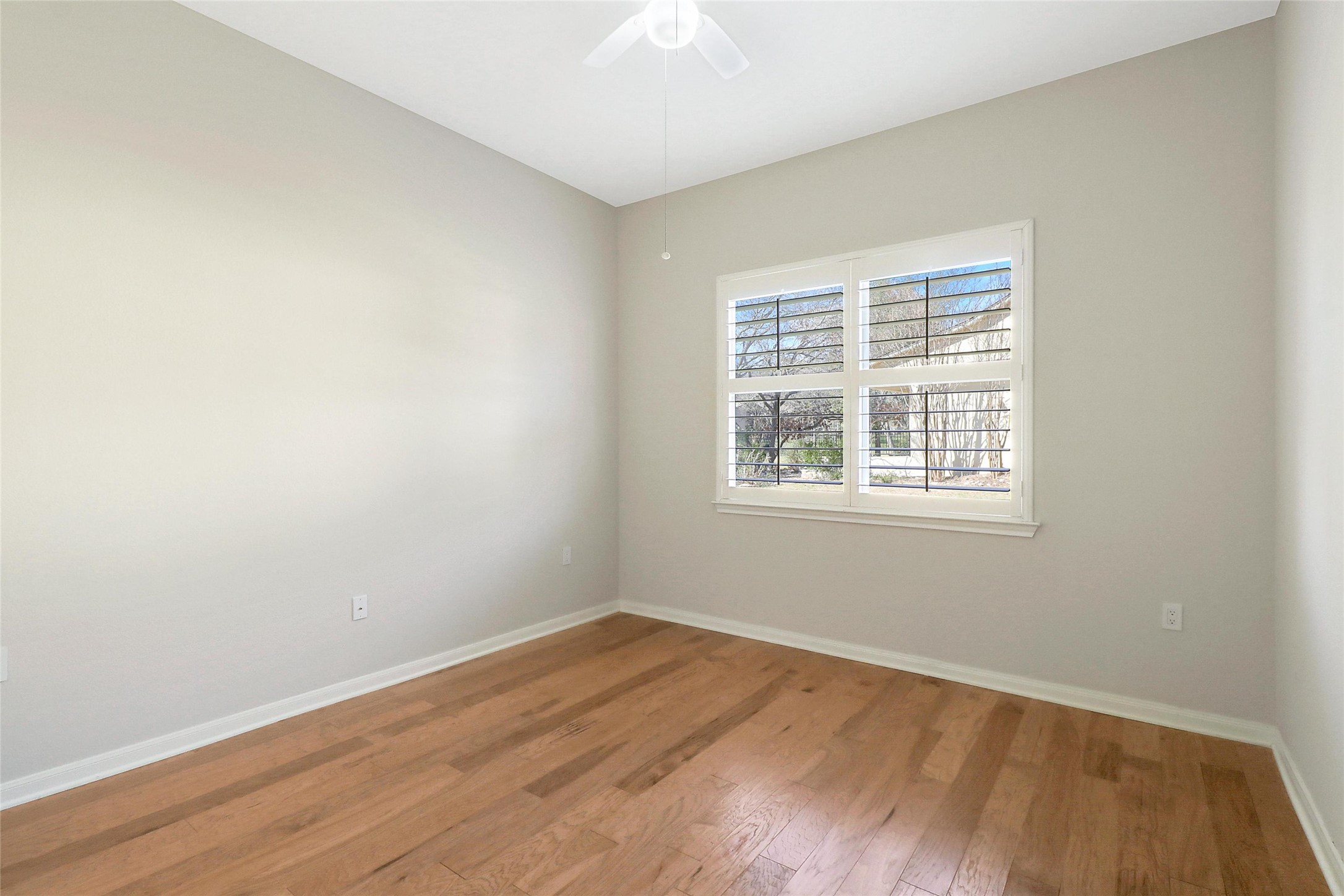 109 Sunflower Street Georgetown, TX 78633 - Photo 15 of 19 Secondary bedroom with hardwood floors.