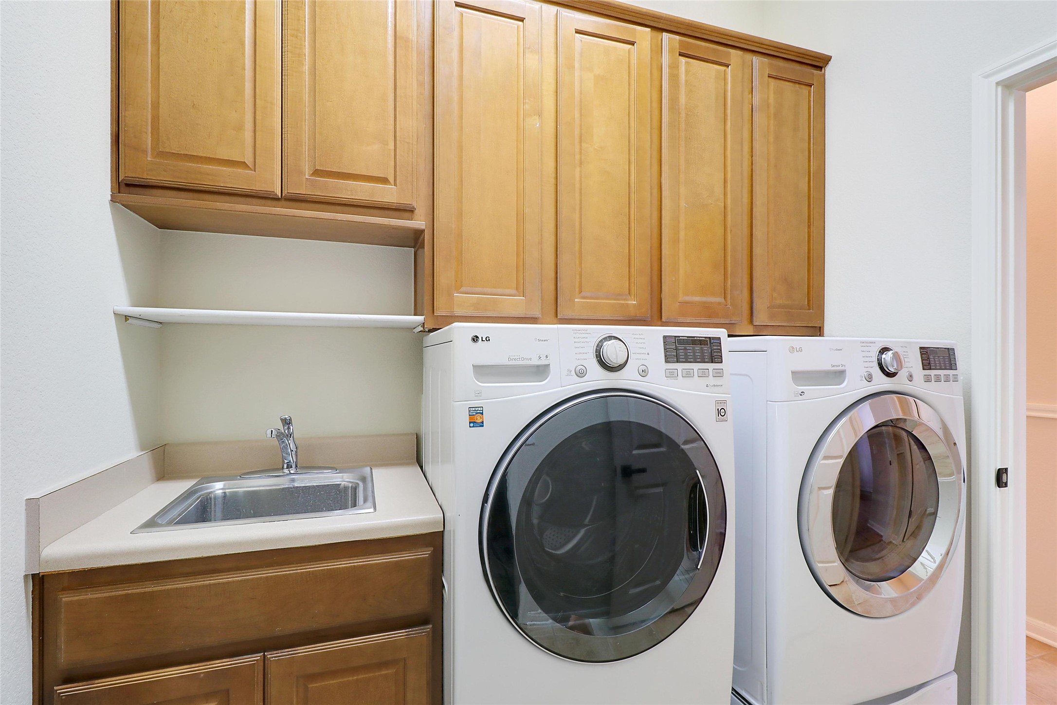 109 Sunflower Street Georgetown, TX 78633 - Photo 17 of 19 Laundry room, washer and dryer included.