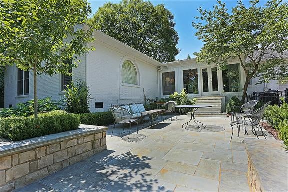 118 Cheek Road Nashville, TN 37205 - Photo 18 of 19 a view of a house with backyard sitting area and garden