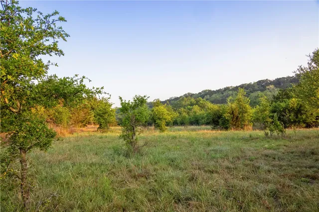a view of an outdoor space with deck and mountain view